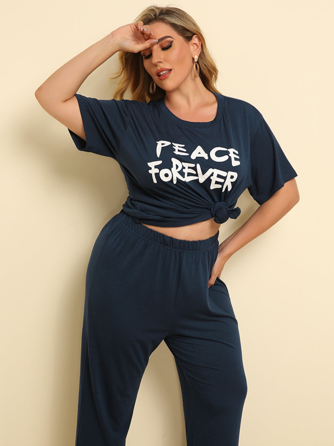 Plus Size PEACE FOREVER Short Sleeve Top and Pants Set - ships from supplier in approximately 10 business days